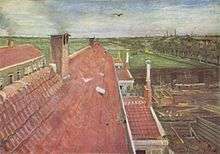  A view of red rooftops drawn from above in exact perspective with green meadows stretching into the distance. There is a carpenter's yard below.